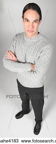 Stock Image - Serious man in gray sweater. Fotosearch