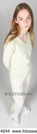 Picture - Serious teenaged girl in white sweater. Fotosearch