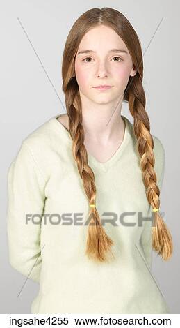 Serious teenaged girl wearing braids View Large Photo Image Stock Photography - Serious teenaged girl wearing braids. Fotosearch