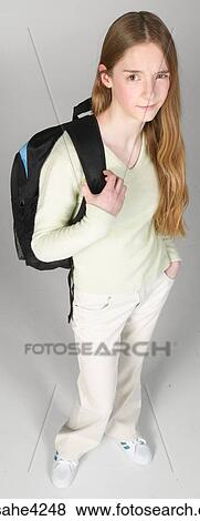 Skeptical teenaged girl carrying backpack View Large Photo Image Stock Photo - Skeptical teenaged girl carrying backpack. Fotosearch