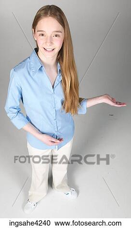 Stock Image - Smiling and gesturing teenaged girl. Fotosearch