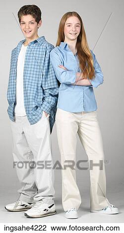 Smiling boy and girl standing beside each other View Large Photo Image Stock Image - Smiling boy and girl standing beside each other . Fotosearch