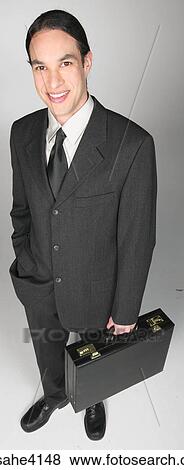 Stock Photo - Smiling businessman holding briefcase . Fotosearch