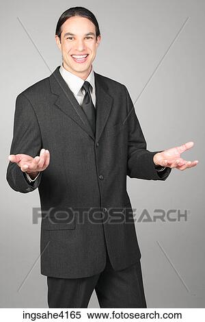 Smiling businessman holding out his arms View Large Photo Image Stock Photography - Smiling businessman holding out his arms. Fotosearch