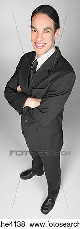 Smiling businessman in gray suit View Large Photo Image Stock Photo - Smiling businessman in gray suit . Fotosearch