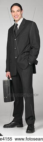 Smiling businessman in gray suit View Large Photo Image Stock Photography - Smiling businessman in gray suit . Fotosearch