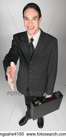 Smiling businessman shaking hands View Large Photo Image Stock Image - Smiling businessman shaking hands. Fotosearch