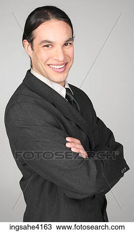 Smiling businessman with crossed arms View Large Photo Image Stock Image - Smiling businessman with crossed arms . Fotosearch