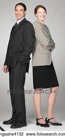 Smiling businesspeople standing together View Large Photo Image Stock Image - Smiling businesspeople standing together . Fotosearch