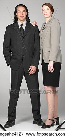 Smiling businesspeople standing together View Large Photo Image Stock Photo - Smiling businesspeople standing together . Fotosearch