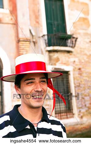 Smiling gondolier in front of building windows View Large Photo Image Picture - Smiling gondolier in front of building windows . Fotosearch