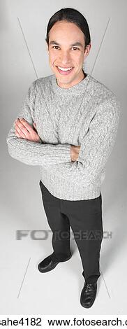 Smiling man in gray sweater View Large Photo Image Stock Image - Smiling man in gray sweater. Fotosearch