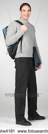 Smiling student carrying backpack and books View Large Photo Image Stock Image - Smiling student carrying backpack and books. Fotosearch