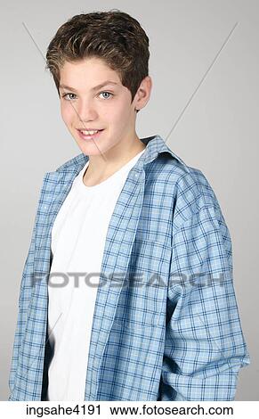 Smiling teenaged boy in blue shirt View Large Photo Image Stock Image - Smiling teenaged boy in blue shirt. Fotosearch
