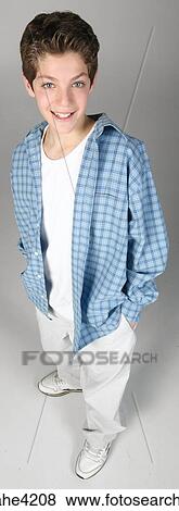 Smiling teenaged boy in blue shirt View Large Photo Image Stock Photo - Smiling teenaged boy in blue shirt . Fotosearch