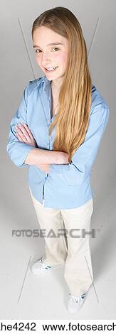 Smiling teenaged girl in blue blouse View Large Photo Image Stock Image - Smiling teenaged girl in blue blouse . Fotosearch