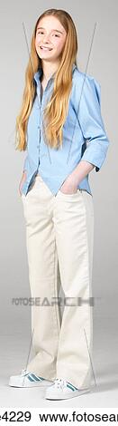 Smiling teenaged girl in blue blouse View Large Photo Image Stock Photo - Smiling teenaged girl in blue blouse. Fotosearch