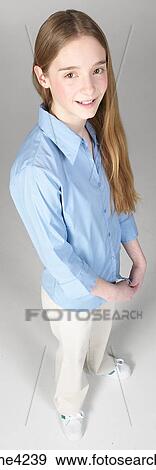 Smiling teenaged girl in blue blouse View Large Photo Image Stock Photo - Smiling teenaged girl in blue blouse . Fotosearch