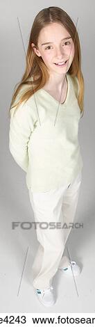 Smiling teenaged girl in white sweater View Large Photo Image Stock Image - Smiling teenaged girl in white sweater. Fotosearch