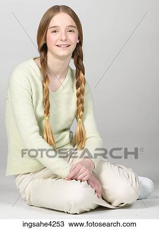 Smiling teenaged girl wearing braids View Large Photo Image Stock Image - Smiling teenaged girl wearing braids. Fotosearch