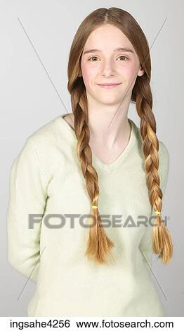 Smiling teenaged girl wearing braids View Large Photo Image Stock Photograph - Smiling teenaged girl wearing braids . Fotosearch