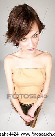 Smiling woman in brown outfit View Large Photo Image Picture - Smiling woman in brown outfit . Fotosearch