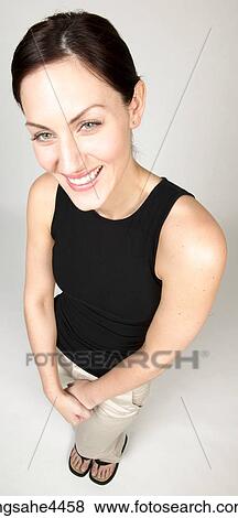 Smiling woman in casual attire View Large Photo Image Stock Photo - Smiling woman in casual attire. Fotosearch