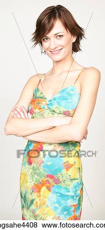 Smiling woman in floral sundress View Large Photo Image Stock Photo - Smiling woman in floral sundress. Fotosearch
