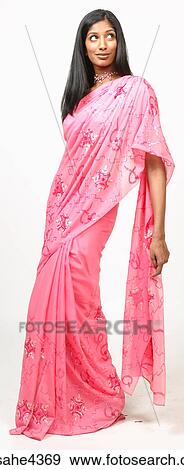Smiling woman in pink sari View Large Photo Image Stock Photo - Smiling woman in pink sari . Fotosearch