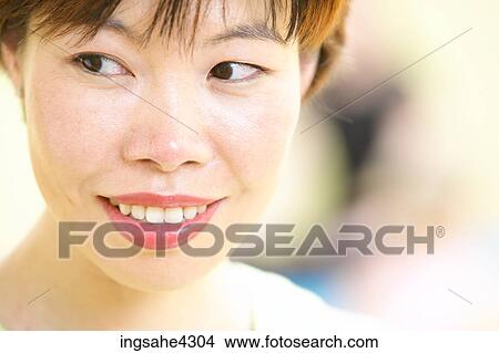Picture - Smiling woman looking sideways. Fotosearch