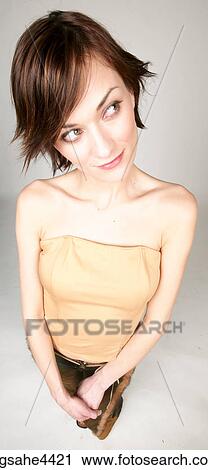 Smiling woman looking sideways View Large Photo Image Stock Image - Smiling woman looking sideways . Fotosearch