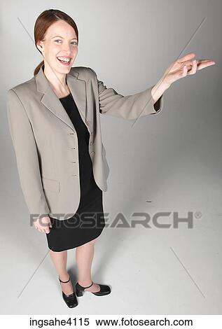 Smiling woman making a presentation View Large Photo Image Stock Photography - Smiling woman making a presentation. Fotosearch