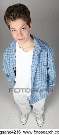 Smirking teenaged boy View Large Photo Image Stock Photograph - Smirking teenaged boy. Fotosearch