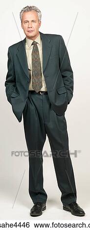 Standing businessman View Large Photo Image Stock Photograph - Standing businessman. Fotosearch