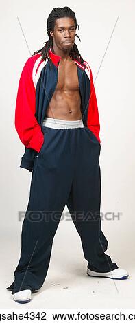 Standing man in red and blue track suit View Large Photo Image Stock Image - Standing man in red and blue track suit . Fotosearch