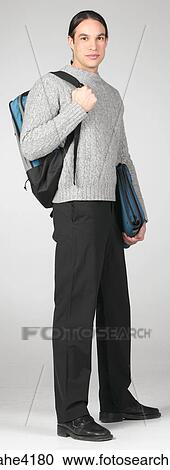 Student in gray sweater carrying backpack and books View Large Photo Image Stock Image - Student in gray sweater carrying backpack and books. Fotosearch