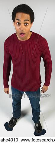 Surprised man in jeans and red sweater View Large Photo Image Stock Image - Surprised man in jeans and red sweater . Fotosearch