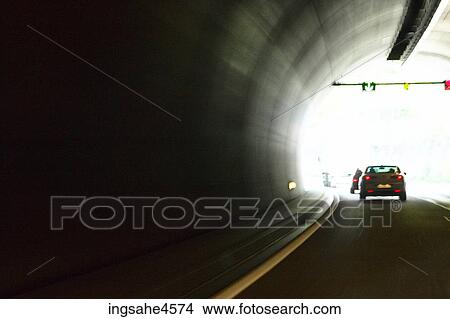 Tail lights of car driving through tunnel View Large Photo Image Picture - Tail lights of car driving through tunnel . Fotosearch