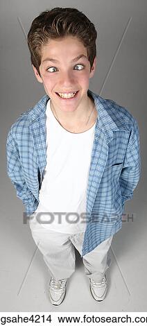 Teenaged boy crossing his eyes View Large Photo Image Picture - Teenaged boy crossing his eyes. Fotosearch