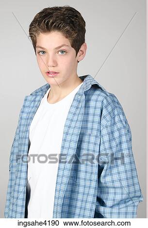 Teenaged boy in blue shirt View Large Photo Image Stock Image - Teenaged boy in blue shirt . Fotosearch