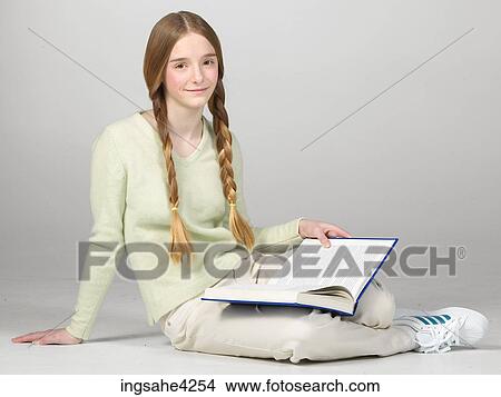 Teenaged girl with braids reading book View Large Photo Image Picture - Teenaged girl with braids reading book. Fotosearch