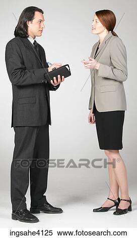 Two businesspeople setting up a meeting View Large Photo Image Stock Photography - Two businesspeople setting up a meeting. Fotosearch