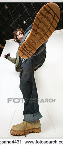 View of man's kicking boot from below View Large Photo Image Stock Image - View of man's kicking boot from below. Fotosearch
