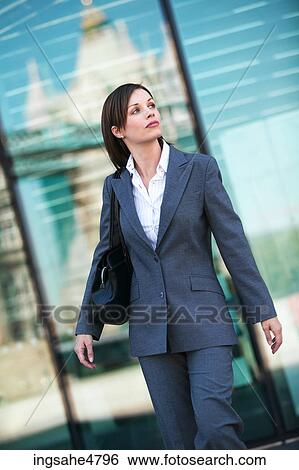Stock Photograph - Walking businesswoman . Fotosearch