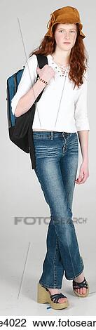 Woman carrying a backpack View Large Photo Image Stock Image - Woman carrying a backpack . Fotosearch