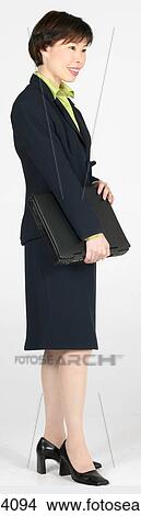 Picture - Woman holding a laptop . Fotosearch