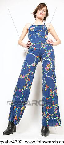 Stock Image - Woman in blue outfit standing with attitude . Fotosearch