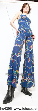 Woman in blue outfit standing with attitude View Large Photo Image Stock Photography - Woman in blue outfit standing with attitude . Fotosearch