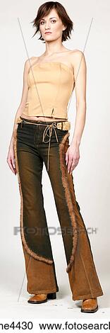 Stock Image - Woman in brown cords and shirt. Fotosearch