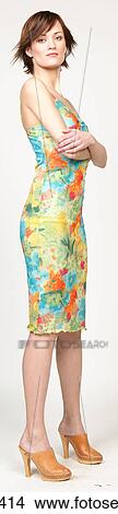 Woman in colorful floral sundress View Large Photo Image Picture - Woman in colorful floral sundress . Fotosearch